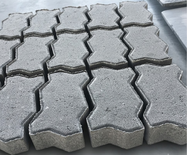 Gallery of interlocking concrete pavers from Jamaica Block Factory showcasing colors, patterns, and finishes.
